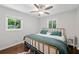 A bedroom with a modern bed frame, neutral walls and hardwood floor at 481 Meadowbrook Se Dr, Marietta, GA 30067