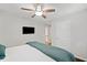 A bedroom with a TV, neutral walls, and hardwood floor at 481 Meadowbrook Se Dr, Marietta, GA 30067