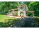 Charming home with brick exterior, shutters, manicured lawn, and inviting front entrance at 481 Meadowbrook Se Dr, Marietta, GA 30067