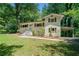 Charming home with brick exterior, shutters, manicured lawn, and inviting front entrance at 481 Meadowbrook Se Dr, Marietta, GA 30067