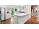 White kitchen with island, stainless steel appliances and access to the outdoor deck at 481 Meadowbrook Se Dr, Marietta, GA 30067