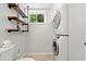 A laundry area featuring a stacked washer dryer at 481 Meadowbrook Se Dr, Marietta, GA 30067