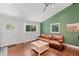 Light filled living room with hardwood floors, recessed lighting, and a leather sofa at 481 Meadowbrook Se Dr, Marietta, GA 30067