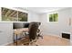 Home office featuring modern desk, hardwood floors and ample sunlight at 481 Meadowbrook Se Dr, Marietta, GA 30067