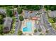 An aerial view of community with swimming pool, surrounded by townhouses and lush landscaping at 6851 Roswell Rd # G3, Atlanta, GA 30328