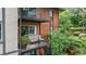 Exterior shot of a balcony with lounge furniture and a view of mature landscaping at 6851 Roswell Rd # G3, Atlanta, GA 30328