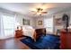 Cozy bedroom with natural light, ceiling fan, and hardwood floors at 6851 Roswell Rd # G3, Atlanta, GA 30328