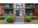Attractive building entrance with brick steps and balcony views, conveniently located near accessible parking at 6851 Roswell Rd # G3, Atlanta, GA 30328