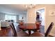 Cozy dining area with a round wooden table, seating for four, and view to the living room at 6851 Roswell Rd # G3, Atlanta, GA 30328