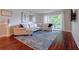 Inviting living room with a large sectional sofa, stylish rug, and a sliding glass door to the outside at 6851 Roswell Rd # G3, Atlanta, GA 30328