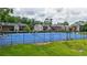 A landscaped view of the tennis courts near townhouses, offering recreational opportunities at 6851 Roswell Rd # G3, Atlanta, GA 30328