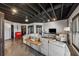Large finished basement with concrete floors, neutral walls, black ceiling, kitchenette, and an entertainment area at 101 Bevil Ridge Se Rd, Emerson, GA 30137