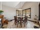 Cozy dining area with wood table, chairs, and natural light from large windows at 101 Bevil Ridge Se Rd, Emerson, GA 30137