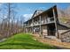 Back of house featuring a multi-level deck, walk out basement, and well-maintained lawn at 101 Bevil Ridge Se Rd, Emerson, GA 30137