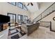 Living room with high ceilings, many windows, and stone tile flooring at 101 Bevil Ridge Se Rd, Emerson, GA 30137