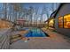 Beautiful backyard pool with patio, outdoor seating, and views of nature for luxurious relaxation at 101 Bevil Ridge Se Rd, Emerson, GA 30137