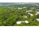 Beautiful aerial view of lush green neighborhood with multiple buildings and a pool at 26303 Plantation Ne Dr # 303, Atlanta, GA 30324
