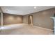 Large unfinished basement with neutral walls and carpet floors at 26303 Plantation Ne Dr # 303, Atlanta, GA 30324
