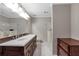 Bathroom with double vanity, marble floors, and marble countertops at 26303 Plantation Ne Dr # 303, Atlanta, GA 30324
