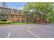 Beautiful brick apartment building with manicured landscaping and mature shade trees at 26303 Plantation Ne Dr # 303, Atlanta, GA 30324