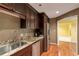 A kitchen showcases stainless steel appliances, granite countertops, and wood cabinetry, offering a functional space at 26303 Plantation Ne Dr # 303, Atlanta, GA 30324