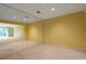 Spacious living room with large mirrors, neutral walls, and carpeted floors, perfect for relaxation or entertainment at 26303 Plantation Ne Dr # 303, Atlanta, GA 30324
