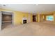 Bright living room features yellow walls, fireplace, and an open layout connecting to the kitchen at 26303 Plantation Ne Dr # 303, Atlanta, GA 30324