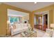 Bright living room with a fireplace, and access to a balcony providing a cozy and inviting atmosphere at 26303 Plantation Ne Dr # 303, Atlanta, GA 30324