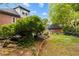 Exterior view of brick two story home featuring a backyard pond at 2870 Livsey Woods Dr, Tucker, GA 30084
