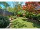 Well-manicured backyard featuring a beautiful garden and lush green grass at 2870 Livsey Woods Dr, Tucker, GA 30084