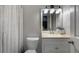 Well lit bathroom with a combination shower and tub and ample vanity storage at 2870 Livsey Woods Dr, Tucker, GA 30084