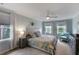 Serene bedroom with soft color palette, neutral carpet, and ample natural light from multiple windows at 2870 Livsey Woods Dr, Tucker, GA 30084
