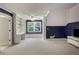 Spacious bonus room features a large window with cushioned seating, built-in shelves, and neutral carpeting at 2870 Livsey Woods Dr, Tucker, GA 30084