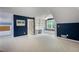 Large bonus room with window seat, built in shelves and an ample seating area at 2870 Livsey Woods Dr, Tucker, GA 30084