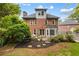 Brick two story home featuring a walkout basement and gorgeous landscaping at 2870 Livsey Woods Dr, Tucker, GA 30084