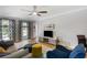 Comfortable living room with neutral walls, a ceiling fan, and ample natural light at 2870 Livsey Woods Dr, Tucker, GA 30084