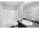 Bathroom with tub and shower combination, and dark vanity at 403 Village Vw, Woodstock, GA 30188
