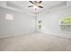 Spacious bedroom features white shiplap wall, recessed lighting, tray ceiling, and carpeted floors at 403 Village Vw, Woodstock, GA 30188