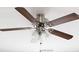Ceiling fan with dark wood blades and decorative light fixture at 403 Village Vw, Woodstock, GA 30188
