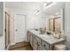 Bright bathroom features double sinks, granite countertops, and a glass-enclosed shower at 4967 Zoya Sw Ct, Atlanta, GA 30331