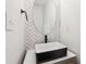 Modern bathroom featuring stylish vanity, an oval mirror, and designer faucet at 4967 Zoya Sw Ct, Atlanta, GA 30331
