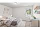 Bright bedroom with a large window, and a desk area perfect for work or study at 4967 Zoya Sw Ct, Atlanta, GA 30331