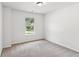 Bright bedroom with carpet, a window for natural light, and neutral colors at 4967 Zoya Sw Ct, Atlanta, GA 30331