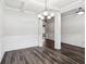 Spacious dining area with hardwood floors, coffered ceilings, and modern lighting at 4967 Zoya Sw Ct, Atlanta, GA 30331
