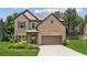 Charming two-story brick home with well-manicured lawn and attached two-car garage at 4967 Zoya Sw Ct, Atlanta, GA 30331