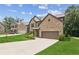 A charming two-story home with brick facade, attached two-car garage, and well-manicured lawn and landscaping at 4967 Zoya Sw Ct, Atlanta, GA 30331