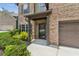 Inviting front entrance with stylish door, manicured landscaping, and covered porch at 4967 Zoya Sw Ct, Atlanta, GA 30331