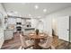 Bright kitchen with stainless steel appliances, island, and casual dining area at 4967 Zoya Sw Ct, Atlanta, GA 30331