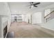 Spacious living area with open floor plan connecting to modern kitchen and staircase at 4967 Zoya Sw Ct, Atlanta, GA 30331