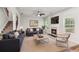 Cozy living room with fireplace, comfortable seating, and large windows at 4967 Zoya Sw Ct, Atlanta, GA 30331